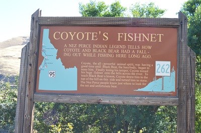 A brown interpretive sign with the words 'Coyote Fishnet' on it.