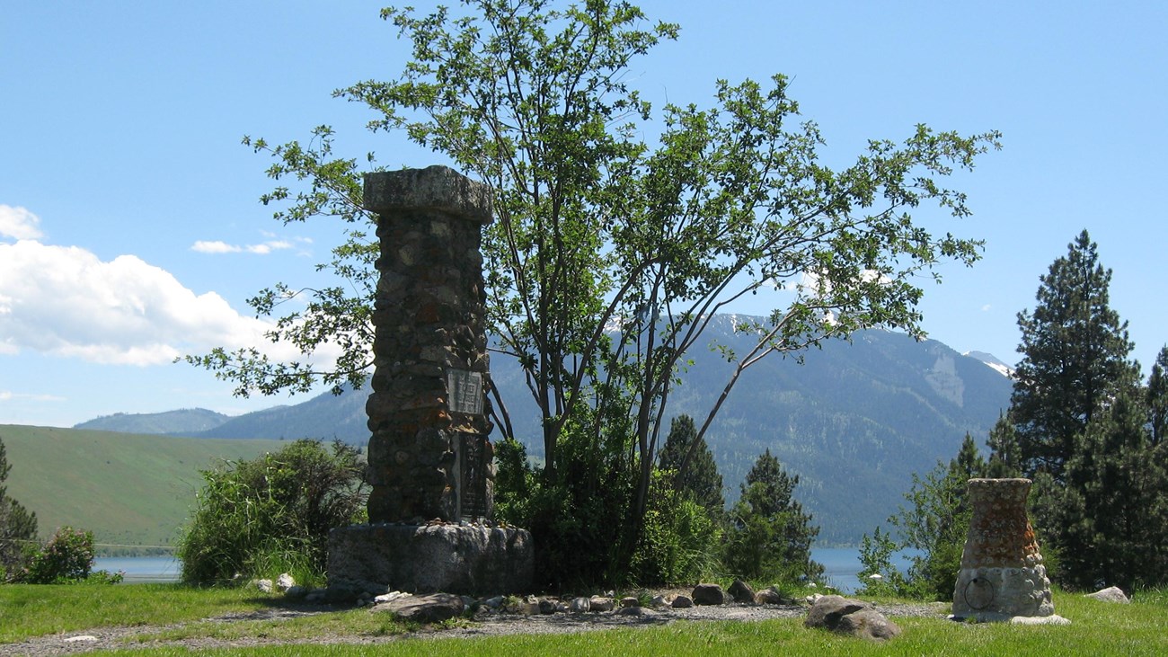 A large tombstone made of many rocks cobbled together.